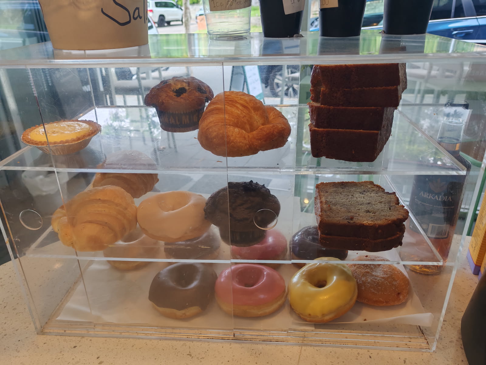 The pastry cabinet — croissants, muffins, danishes and doughnuts